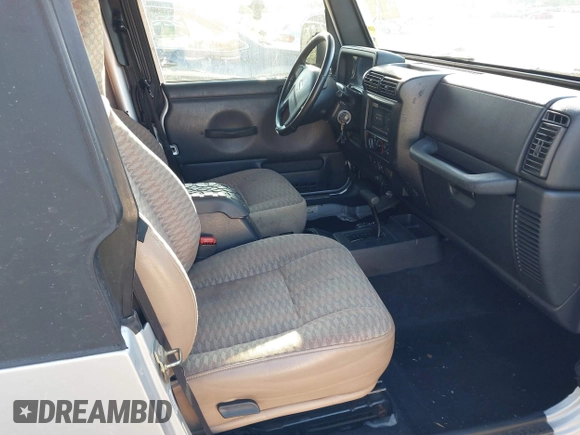 2005 Jeep Wrangler Unlimited with VIN 1J4FA44S65P335444, listed as a IAAI auction lot 41731093 with 143,918 mi miles. Bid and sale history available at carsss.com. Image 5.