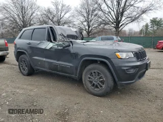 2018 Jeep Grand Cherokee Laredo E with VIN 1C4RJFAG8JC457884, listed as a Copart auction lot 50303215 with Not Provided miles and Salvage Title. Bid and sale history available at DreamBid. Image 4.