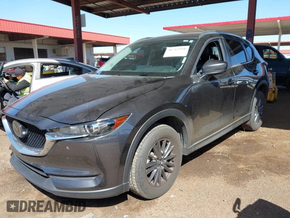 2021 Mazda CX-5 Touring with VIN JM3KFACM2M1313750, listed as a IAAI auction lot 41762938 with 68,503 mi miles. Bid and sale history available at carsss.com. Image 17.