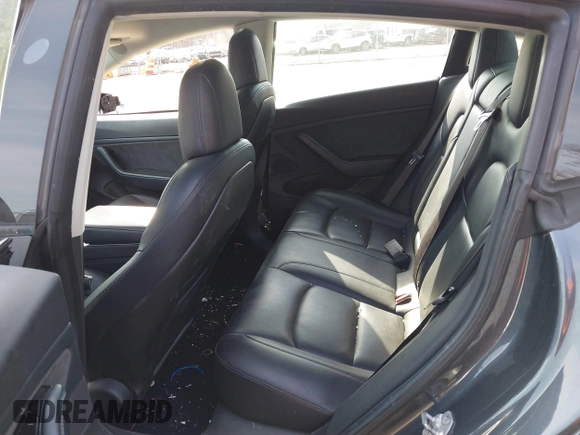 2018 Tesla Model 3 Long Range Battery with VIN 5YJ3E1EB5JF063077, listed as a IAAI auction lot 41773551 with 99,477 mi miles and . Bid and sale history available at DreamBid. Image 8.