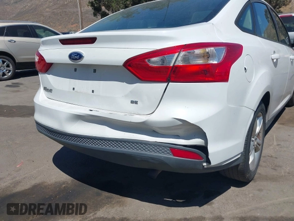 2013 Ford Focus SE z VIN 1FADP3F25DL290446, wystawiony jako IAAI lot #42520571 z przebiegiem 158 020 mil mil oraz . Historia ofert i sprzedaży dostępna na DreamBid. Obrazek 6.