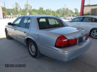 2001 Mercury Grand Marquis LS z VIN 2MEFM75W91X660964, wystawiony jako IAAI lot #42250931 z przebiegiem 74 462 mil mil oraz . Historia ofert i sprzedaży dostępna na DreamBid. Obrazek 3.