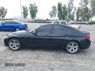 2014 BMW 3 Series 320i with VIN WBA3B1G57ENS80800, listed as a IAAI auction lot 42097683 with 152,924 mi miles. Bid and sale history available at carsss.com. Image 14.