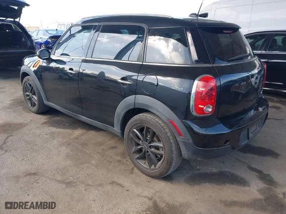 2012 MINI Cooper Countryman with VIN WMWZB3C52CWM06855, listed as a IAAI auction lot 41880609 with 59,319 mi miles. Bid and sale history available at carsss.com. Image 3.
