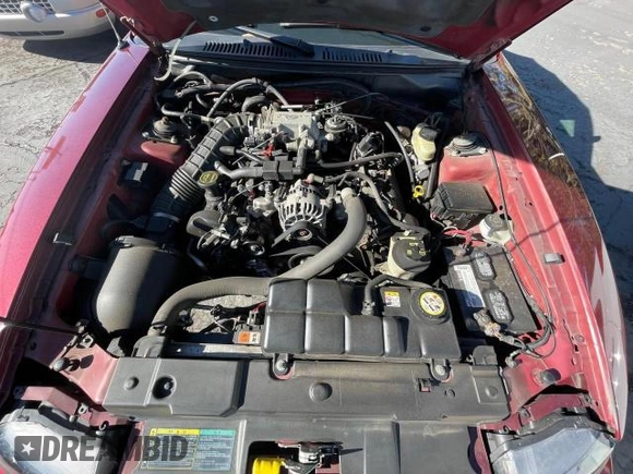 2004 Ford Mustang GT Deluxe z VIN 1FAFP45XX4F150757, wystawiony jako Copart lot #51550375 z przebiegiem 43 827 mil mil oraz Tytuł czysty. Historia ofert i sprzedaży dostępna na DreamBid. Obrazek 7.