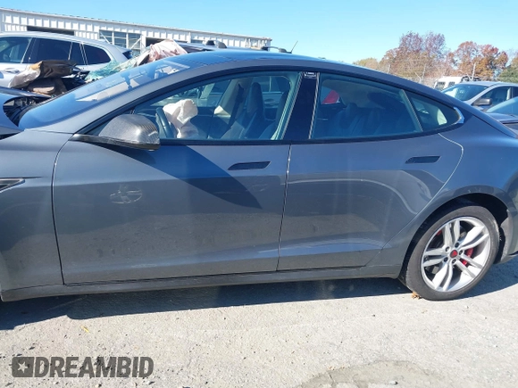 2013 Tesla Model S Performance with VIN 5YJSA1DP7DFP11737, listed as a IAAI auction lot 40915195 with Not provided miles and . Bid and sale history available at DreamBid. Image 13.