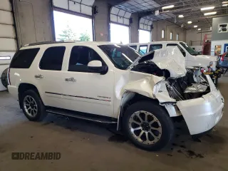 2012 GMC Yukon Denali with VIN 1GKS2EEF3CR140772, listed as a Copart auction lot 69621614 with 207,425 mi miles and Salvage Title. Bid and sale history available at carsss.com. Image 4.