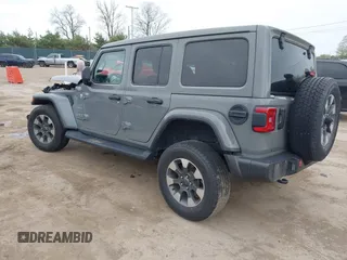 2022 Jeep Wrangler Unlimited Sahara with VIN 1C4HJXEG7NW138105, listed as a IAAI auction lot 42146898 with Not provided miles and . Bid and sale history available at DreamBid. Image 3.