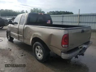 2003 Ford F-150 XL with VIN 1FTRX17LX3NA38576, listed as a Copart auction lot 54057495 with 173,811 mi miles and Salvage title. Bid and sale history available at DreamBid. Image 2.
