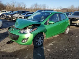 2012 Mazda Mazda2 Touring with VIN JM1DE1LZXC0147823, listed as a Copart auction lot 84079754 with 152,650 mi miles and Salvage Title. Bid and sale history available at carsss.com. Image 1.
