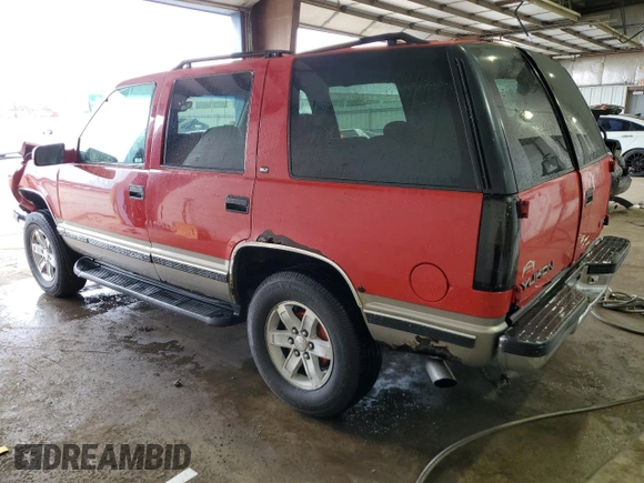 1999 GMC Yukon with VIN 1GKEK13R1XJ711537, listed as a Copart auction lot 51658175 with 228,786 mi miles and Salvage Title. Bid and sale history available at carsss.com. Image 2.