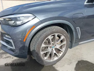 2021 BMW X5 xDrive45e with VIN 5UXTA6C09M9D26035, listed as a IAAI auction lot 41788981 with 60,571 mi miles and . Bid and sale history available at DreamBid. Image 6.
