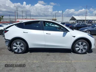2023 Tesla Model Y Long Range with VIN 7SAYGAEE5PF855834, listed as a IAAI auction lot 41943491 with 34,480 mi miles. Bid and sale history available at carsss.com. Image 14.