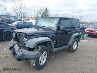 2011 Jeep Wrangler Sport with VIN 1J4AA2D1XBL634783, listed as a IAAI auction lot 41928702 with 154,379 mi miles. Bid and sale history available at carsss.com. Image 2.