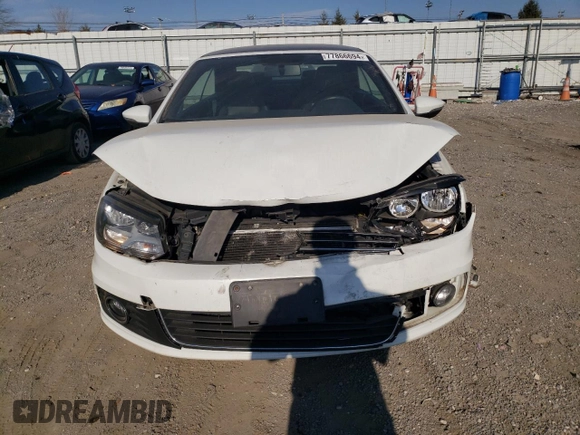 2015 Volkswagen Eos Komfort with VIN WVWBW8AH1FV000692, listed as a Copart auction lot 77866694 with 114,156 mi miles and Salvage Title. Bid and sale history available at DreamBid. Image 5.