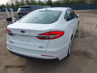 2020 Ford Fusion Hybrid SE with VIN 3FA6P0LU5LR195611, listed as a IAAI auction lot 41807998 with 128,439 mi miles. Bid and sale history available at carsss.com. Image 4.