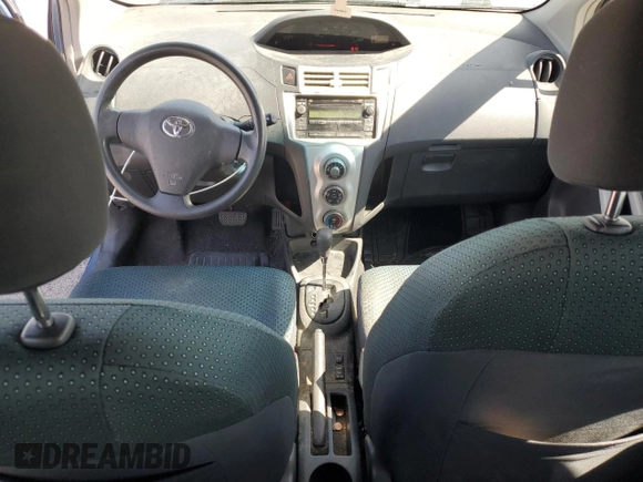 2008 Toyota Yaris with VIN JTDJT923185164654, listed as a Copart auction lot 54052575 with 242,505 mi miles and Salvage Title. Bid and sale history available at DreamBid. Image 8.
