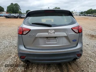 2015 Mazda CX-5 Sport z VIN JM3KE2BE4F0459532, wystawiony jako Copart lot #61049235 z przebiegiem 149 808 mil mil oraz Szkoda całkowita • Salvage title. Historia ofert i sprzedaży dostępna na DreamBid. Obrazek 6.