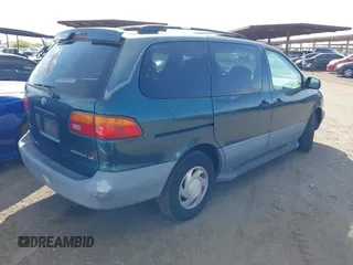 1998 Toyota Sienna LE with VIN 4T3ZF13CXWU049115, listed as a IAAI auction lot 42193159 with 194,313 mi miles and . Bid and sale history available at DreamBid. Image 4.