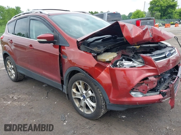 2015 Ford Escape Titanium z VIN 1FMCU9J98FUC84963, wystawiony jako IAAI lot #42469112 z przebiegiem 128 838 mil mil oraz . Historia ofert i sprzedaży dostępna na DreamBid. Obrazek 1.