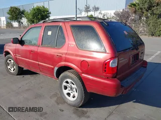 2001 Isuzu Rodeo S with VIN 4S2DM58W814303358, listed as a IAAI auction lot 42695509 with Not provided miles and . Bid and sale history available at DreamBid. Image 3.