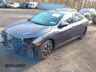 2017 Honda Civic Sedan LX with VIN 19XFC2F56HE233741, listed as a IAAI auction lot 42022068 with 65,587 mi miles. Bid and sale history available at carsss.com. Image 2.