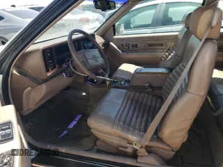 1991 Cadillac Eldorado z VIN 1G6EL13B2MU602660, wystawiony jako Copart lot #67365674 z przebiegiem 108 880 mil mil oraz Szkody całkowita. Historia ofert i sprzedaży dostępna na DreamBid. Obrazek 7.