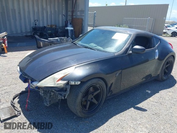 2013 Nissan 370Z z VIN JN1AZ4EH8DM880849, wystawiony jako IAAI lot #42131189 z przebiegiem Nie podano mil oraz . Historia ofert i sprzedaży dostępna na DreamBid. Obrazek 18.