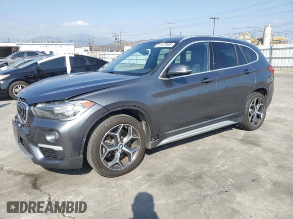 2018 BMW X1 sDrive28i with VIN WBXHU7C35J5L09783, listed as a Copart auction lot 55147935 with 37,114 mi miles and Salvage Title. Bid and sale history available at DreamBid. Image 1.