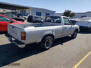 1989 Toyota 2WD Pickups DLX with VIN JT4RN82PXK0001791, listed as a Copart auction lot 72990424 with 168,369 mi miles and Salvage Title. Bid and sale history available at carsss.com. Image 3.