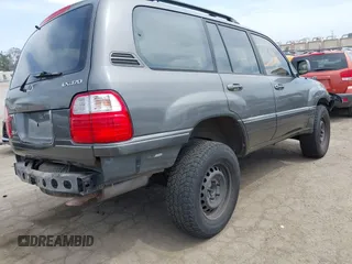 2001 Lexus LX 470 z VIN JTJHT00WX13509489, wystawiony jako IAAI lot #42227083 z przebiegiem 360 283 mil mil oraz . Historia ofert i sprzedaży dostępna na DreamBid. Obrazek 4.
