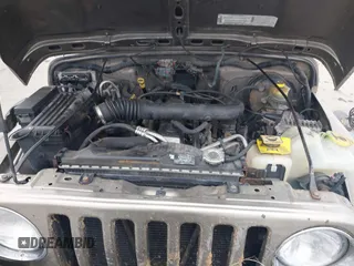 2003 Jeep Wrangler X with VIN 1J4FA39SX3P329386, listed as a IAAI auction lot 41407594 with 140,390 mi miles. Bid and sale history available at carsss.com. Image 10.