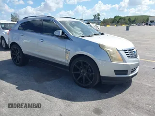 2013 Cadillac SRX z VIN 3GYFNAE32DS512534, wystawiony jako IAAI lot #41596602 z przebiegiem 193 131 mil mil oraz . Historia ofert i sprzedaży dostępna na DreamBid. Obrazek 1.