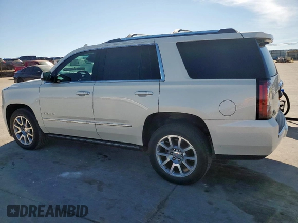 2015 GMC Yukon Denali z VIN 1GKS2CKJ6FR706151, wystawiony jako Copart lot #50556805 z przebiegiem 174 259 mil mil oraz Czysty tytuł • Clean title. Historia ofert i sprzedaży dostępna na DreamBid. Obrazek 2.