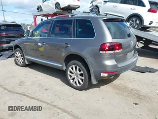 2010 Volkswagen Touareg VR6 with VIN WVGBF7A96AD002466, listed as a IAAI auction lot 41709052 with 204,819 mi miles and . Bid and sale history available at DreamBid. Image 3.
