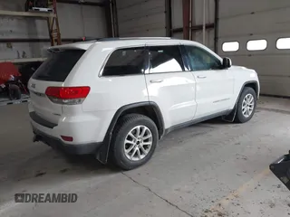 2014 Jeep Grand Cherokee Laredo with VIN 1C4RJFAG4EC309401, listed as a IAAI auction lot 41996233 with 243,541 mi miles and . Bid and sale history available at DreamBid. Image 4.