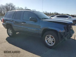 2004 Jeep Grand Cherokee Laredo z VIN 1J4GW48S74C159381, wystawiony jako Copart lot #53972115 z przebiegiem 128 309 mil mil oraz Szkoda całkowita • Salvage title. Historia ofert i sprzedaży dostępna na DreamBid. Obrazek 4.