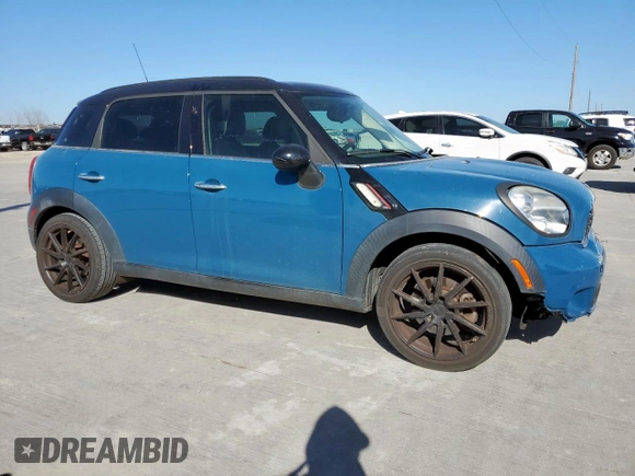 2012 MINI Countryman S with VIN WMWZC3C5XCWM27675, listed as a Copart auction lot 49676205 with 111,499 mi miles and Salvage title. Bid and sale history available at DreamBid. Image 4.