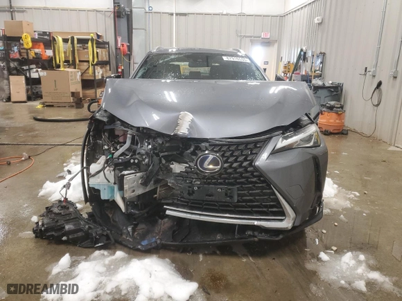 2021 Lexus UX with VIN JTHX9JBH8M2047296, listed as a Copart auction lot 87916535 with 10,297 mi miles and Salvage Title. Bid and sale history available at carsss.com. Image 5.