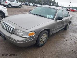 2005 Ford Crown Victoria LX with VIN 2FAFP74W05X174758, listed as a IAAI auction lot 41553606 with 192,103 mi miles. Bid and sale history available at carsss.com. Image 2.