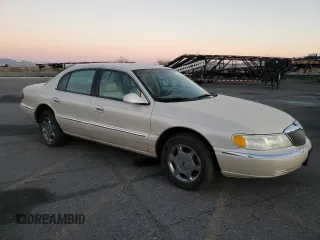 2000 Lincoln Continental with VIN 1LNHM97V0YY807253, listed as a Copart auction lot 80661834 with 130,398 mi miles and Salvage Title. Bid and sale history available at carsss.com. Image 4.