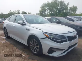 2019 Kia Optima LX z VIN 5XXGT4L32KG294411, wystawiony jako IAAI lot #42393196 z przebiegiem 140 337 mil mil oraz . Historia ofert i sprzedaży dostępna na DreamBid. Obrazek 1.