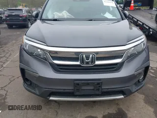 2020 Honda Pilot EX-L with VIN 5FNYF6H5XLB024719, listed as a IAAI auction lot 42168150 with 90,933 mi miles and . Bid and sale history available at carsss.com. Image 12.