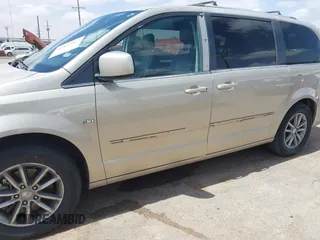 2014 Dodge Grand Caravan SXT with VIN 2C4RDGCG6ER466459, listed as a IAAI auction lot 41820907 with 105,404 mi miles and . Bid and sale history available at DreamBid. Image 6.