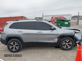 2016 Jeep Cherokee Trailhawk with VIN 1C4PJMBS7GW192574, listed as a IAAI auction lot 41986638 with 144,970 mi miles and . Bid and sale history available at DreamBid. Image 13.
