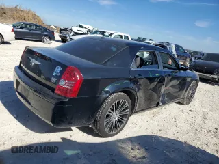 2010 Chrysler 300 with VIN 2C3CA2CV0AH279836, listed as a Copart auction lot 81843694 with 128,515 mi miles and Salvage Title. Bid and sale history available at carsss.com. Image 3.