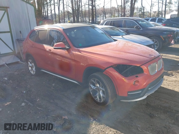 2015 BMW X1 xDrive28i with VIN WBAVL1C58FVY24900, listed as a IAAI auction lot 41772097 with 128,001 mi miles. Bid and sale history available at carsss.com. Image 1.