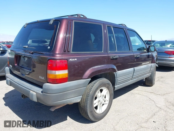 1996 Jeep Grand Cherokee Laredo with VIN 1J4GZ58S3TC391942, listed as a IAAI auction lot 41711778 with 202,765 mi miles. Bid and sale history available at carsss.com. Image 4.