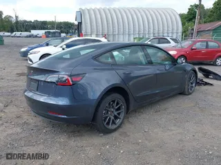 2023 Tesla Model 3 with VIN 5YJ3E1EA3PF494324, listed as a IAAI auction lot 39964499 with 12,501 mi miles. Bid and sale history available at carsss.com. Image 4.