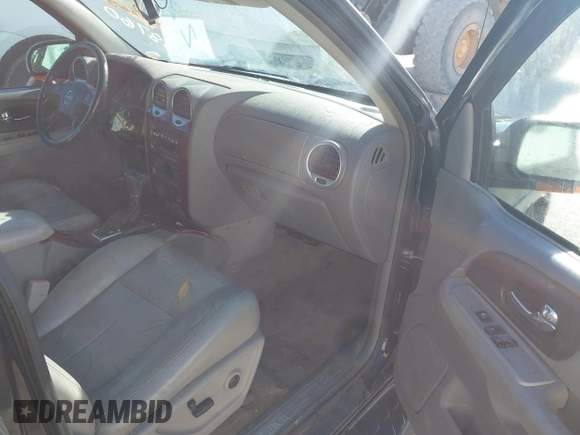2005 GMC Envoy SLE z VIN 1GKDT13S952288760, wystawiony jako IAAI lot #41671656 z przebiegiem Nie podano mil oraz . Historia ofert i sprzedaży dostępna na DreamBid. Obrazek 5.